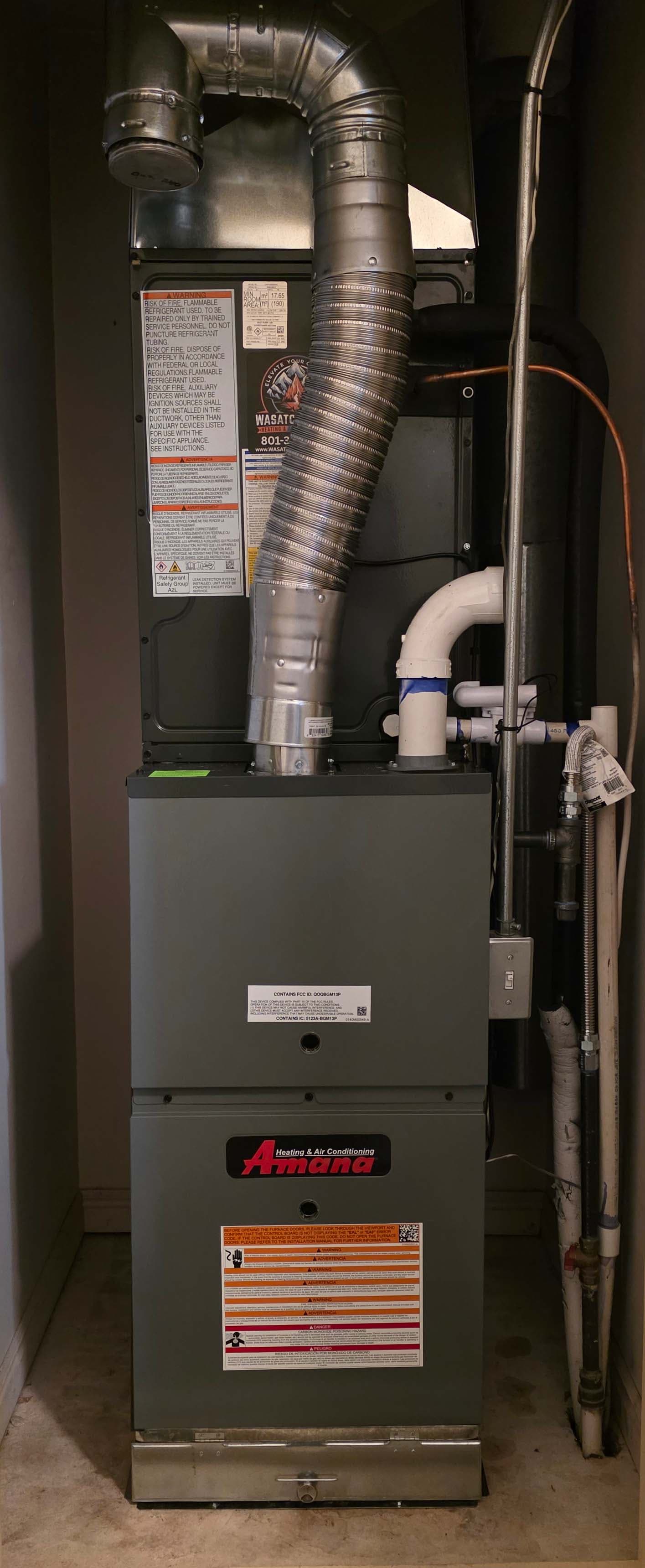 Tall Amana furnace with full ductwork — end-to-end HVAC install